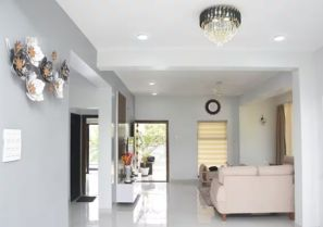 Spacious living room luxury villa Goa with modern decor / Comfortable 5-seater sofa lounge area Devyani Villa / Interior view of Devyani Villa living space