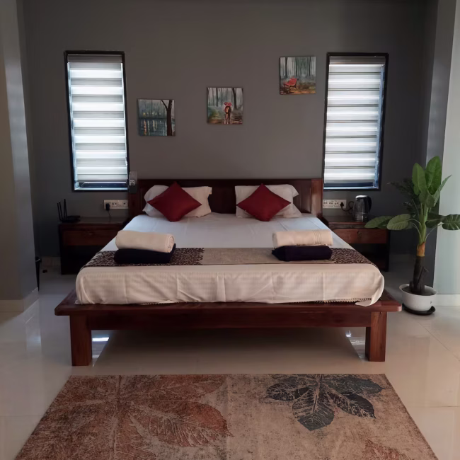 Spacious living room of Devyani Villa with attached balcony and panoramic valley view