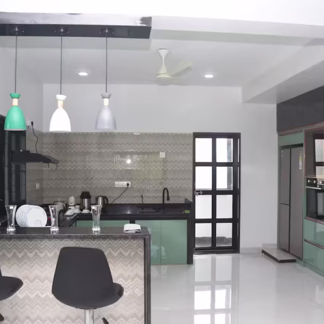 Fully equipped private kitchen for self-cooking Devyani Villa / Modern dining area in luxury 4BHK Goa villa / In-house chef preparing customized meals in villa kitchen