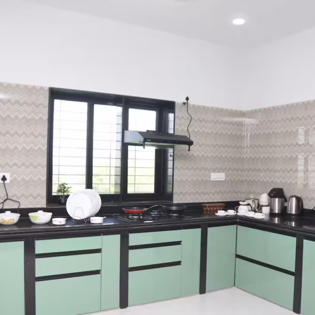 Fully equipped private kitchen for self-cooking Devyani Villa / Modern dining area in luxury 4BHK Goa villa / In-house chef preparing customized meals in villa kitchen