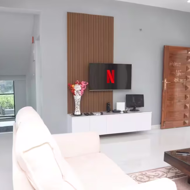 Spacious living room luxury villa Goa with modern decor / Comfortable 5-seater sofa lounge area Devyani Villa / Interior view of Devyani Villa living space