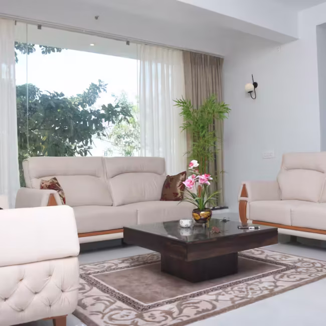 Spacious living room luxury villa Goa with modern decor / Comfortable 5-seater sofa lounge area Devyani Villa / Interior view of Devyani Villa living space