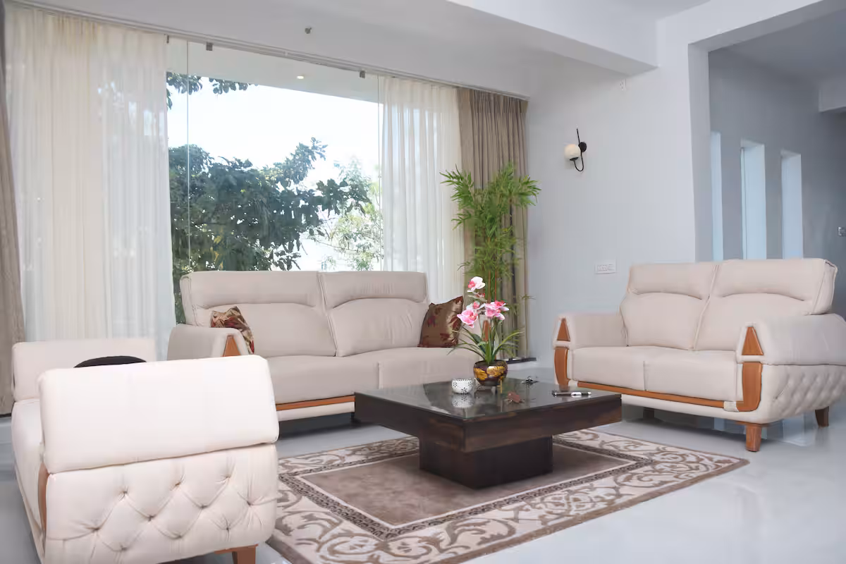 Spacious living room luxury villa Goa with modern decor / Comfortable 5-seater sofa lounge area Devyani Villa / Interior view of Devyani Villa living space