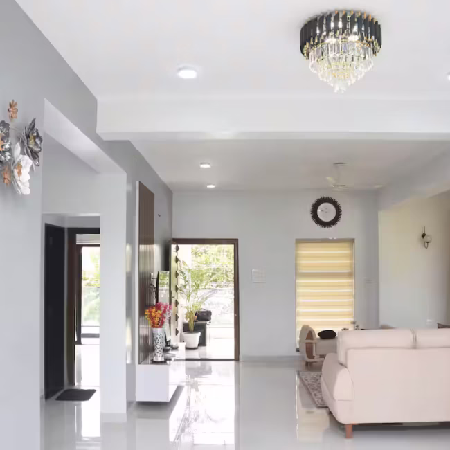 Spacious living room luxury villa Goa with modern decor / Comfortable 5-seater sofa lounge area Devyani Villa / Interior view of Devyani Villa living space