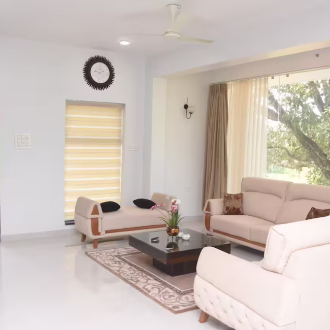Spacious living room luxury villa Goa with modern decor / Comfortable 5-seater sofa lounge area Devyani Villa / Interior view of Devyani Villa living space