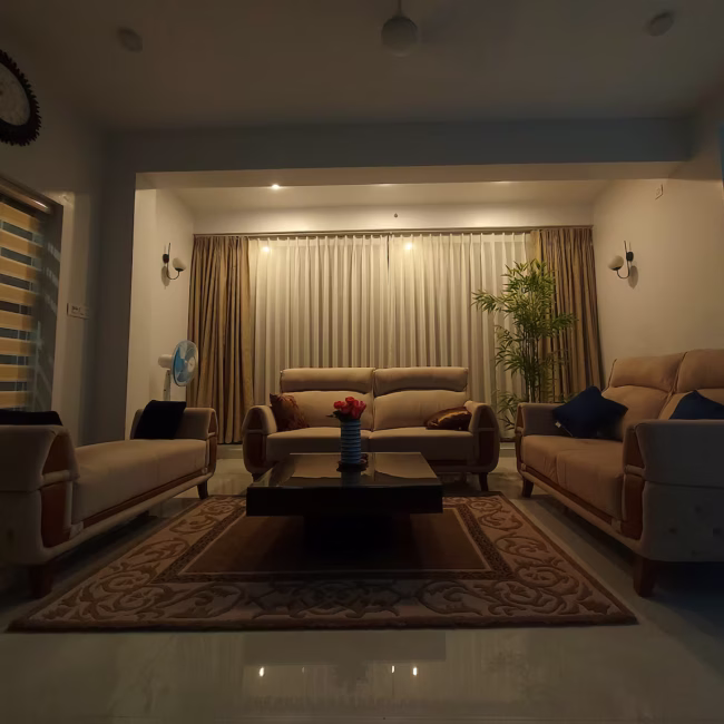 Spacious living room luxury villa Goa with modern decor / Comfortable 5-seater sofa lounge area Devyani Villa / Interior view of Devyani Villa living space