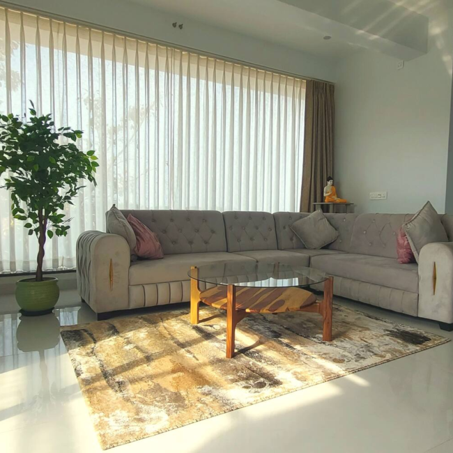 Spacious living room luxury villa Goa with modern decor / Comfortable 5-seater sofa lounge area Devyani Villa / Interior view of Devyani Villa living space