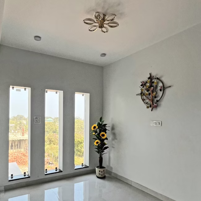 Spacious living room luxury villa Goa with modern decor / Comfortable 5-seater sofa lounge area Devyani Villa / Interior view of Devyani Villa living space